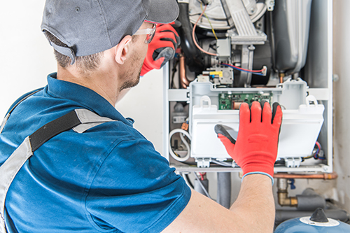 Manasquan heating repair technician at work